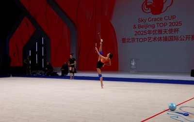 Alina Kabaeva and Irina Leparskaya watch together the floor testing of gymnasts
