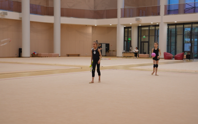 Alina Kabaeva works with Veronika Malinina on the ending of the program with clubs