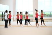 Coach Pooja Surve and gymnasts during choreography