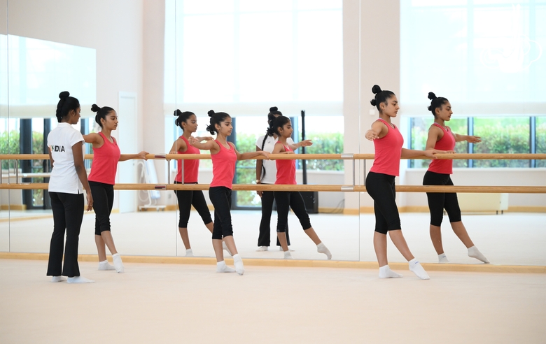 Coach Pooja Surve and gymnasts during choreography