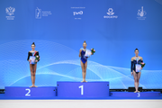 The podium of the final with a ribbon