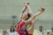 Gymnast during an exercise with clubs