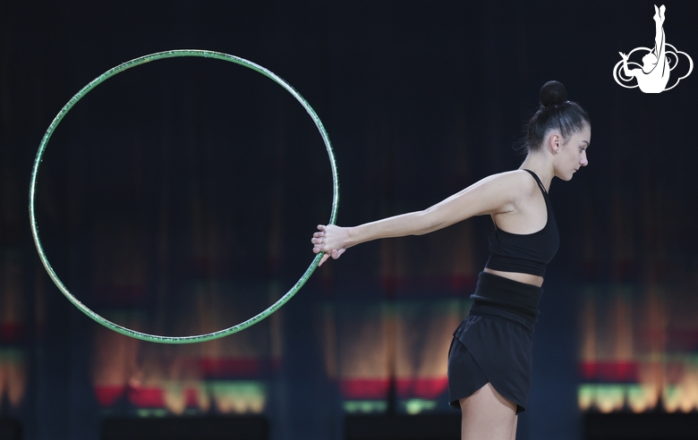 Alina Harnasko during an exercise with a hoop at floor testing