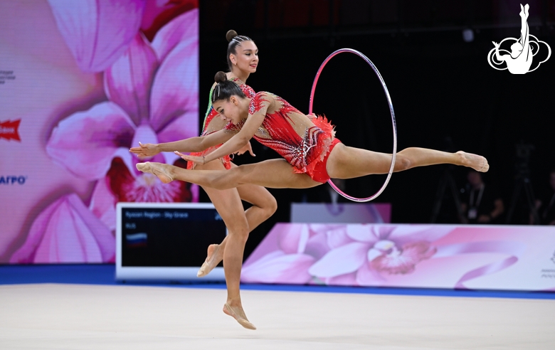 Group team gymnasts from the Ryazan region during an exercise with balls and hoops