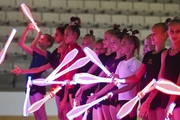 Gymnasts perform tricks with clubs