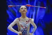 Gymnast during an exercise with clubs