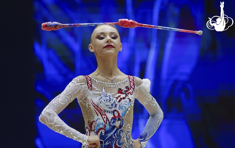 Gymnast during an exercise with clubs