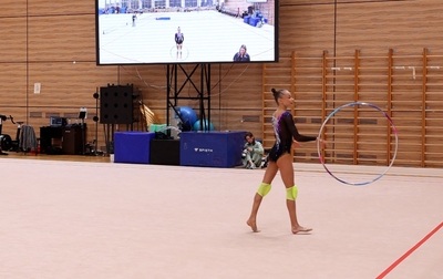 Olympic champion Alina Kabaeva works with Yana Zaikina on a hoop exercise ahead of the AEON Cup