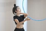 Asel Arapova during an exercise with a hoop during preparation training for the BRICS Games