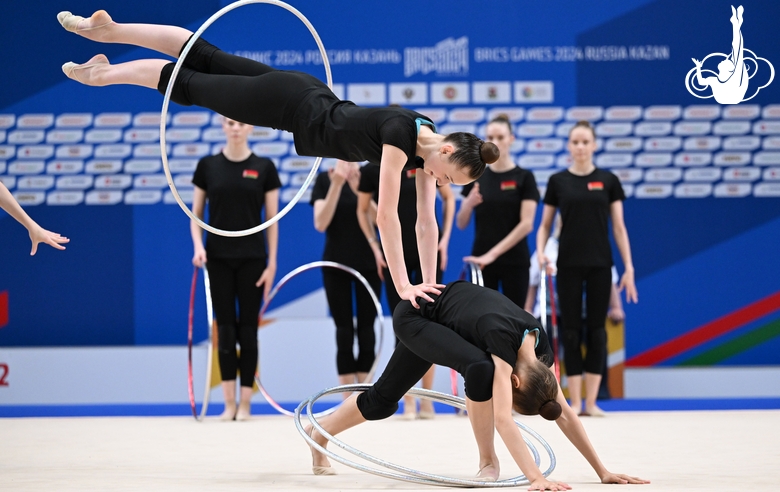 Gymnasts perform exercises with hoops during floor testing before the BRICS Games