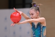 Gymnast during an exercise with a ball during floor testing