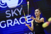 Gymnast during an exercise with clubs at floor testing