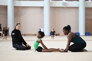 Academy coach Olga Frolova with gymnast Nkenko Sita Davina Chanselvi and coach Dominique Adama from the Republic of Congo during the training session