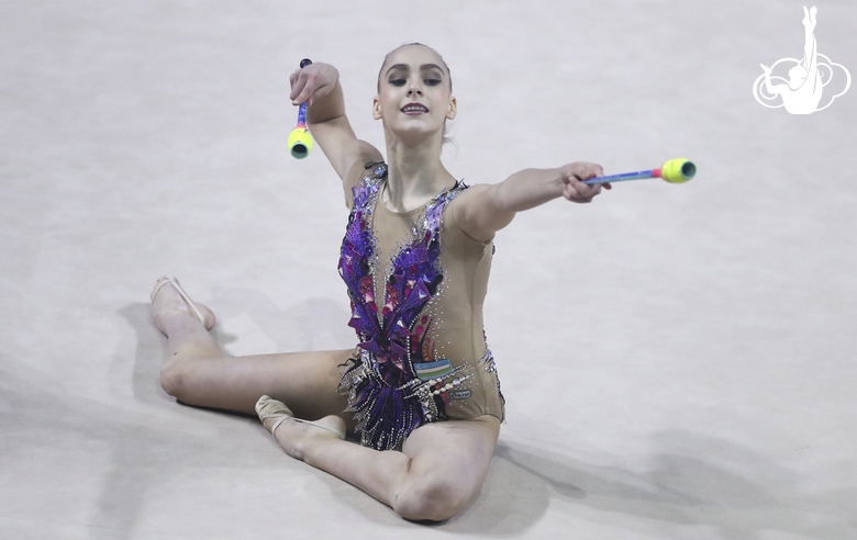 Natalia Usova (Uzbekistan) during an exercise with clubs