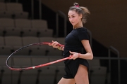 Gymnast during an exercise with a hoop during floor testing