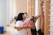 Gymnast with coach Galina Goncharuk during a lesson