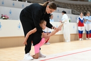 Olympic champion Alina Kabaeva with a young gymnast during selection into the Academy