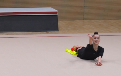 A fragment of how Mariia Borisova is practicing a fiery exercise with a ribbon together with Olympic champion Alina Kabaeva