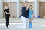 Academy Coach Anna Ustsova with young gymnasts during the exercise