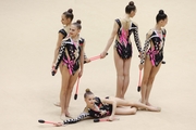 Gymnast during an exercise with clubs