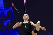 Ksenia Savinova during an exercise with clubs  at floor testing