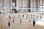 Gymnasts and coach Zlata Tulubaeva during practice at the training camp in the Academy