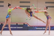 Gymnasts during an exercise with clubs