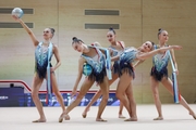 Gymnasts during an exercise with balls and ribbons