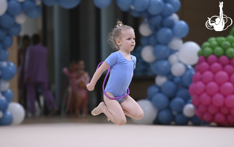 Young gymnast during an exercise with a jump rope at the mAlinka tournament