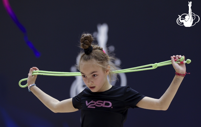 Gymnast during an exercise with a jump rope at floor testing