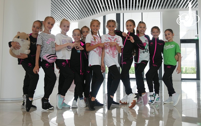 Gymnasts from the Zhemchuzhina Rhythmic Gymnastics Center from St. Petersburg arrive at the Academy training camp