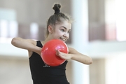 Ksenia Savinova during an exercise with a ball  during training at the Academy