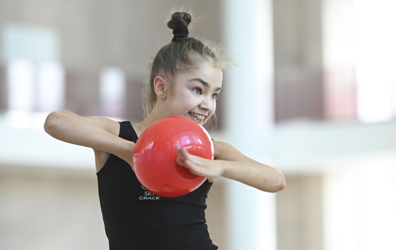 Ksenia Savinova during an exercise with a ball  during training at the Academy