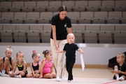 Academy coach Elizaveta Chernova with a young gymnast during the selection