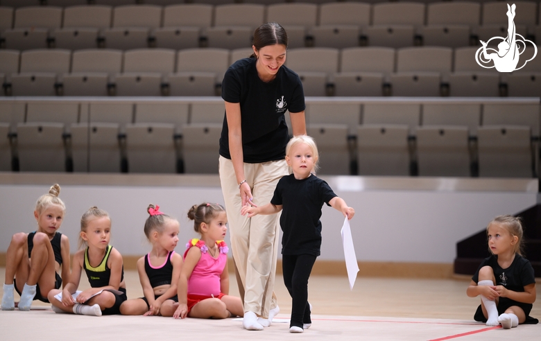 Academy coach Elizaveta Chernova with a young gymnast during the selection