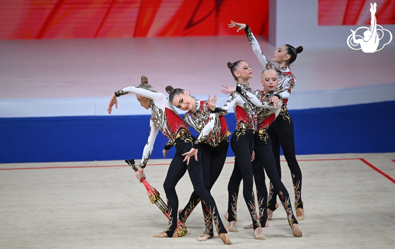 Academy group exercise gymnasts during the exercise with clubs