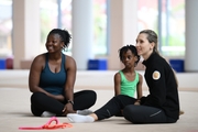 Coach Dominique Adama and gymnast Nkenko Sita Davina Chanselvi from the Republic of Congo with Academy coach Olga Frolova during the training session