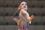 Gymnast during an exercise with clubs