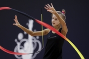 Gymnast during an exercise with a ribbon at floor testing