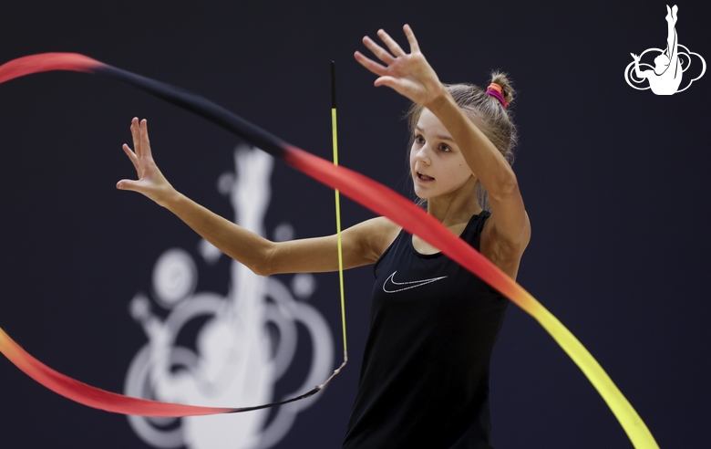 Gymnast during an exercise with a ribbon at floor testing