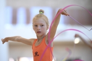 Gymnast performs an exercise with a ribbon