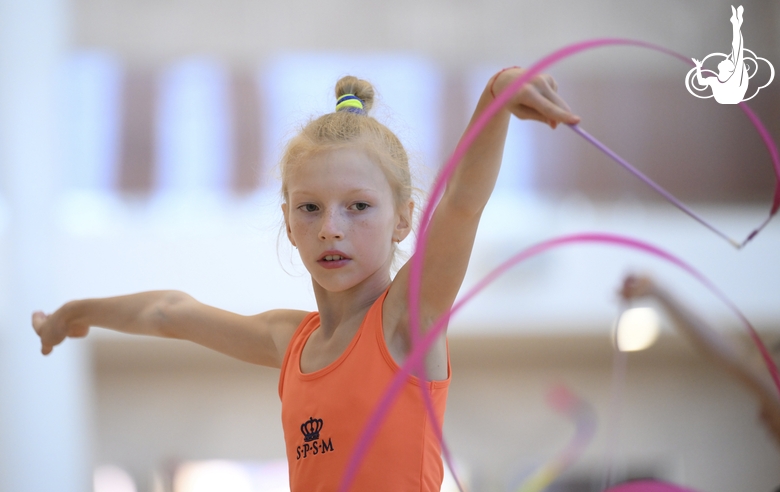 Gymnast performs an exercise with a ribbon