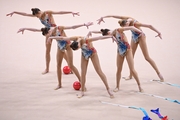 Gymnasts during an exercise with balls and ribbons