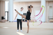 Coach Elizaveta Chernova and gymnast Aryaa Nitesh Kadam during training
