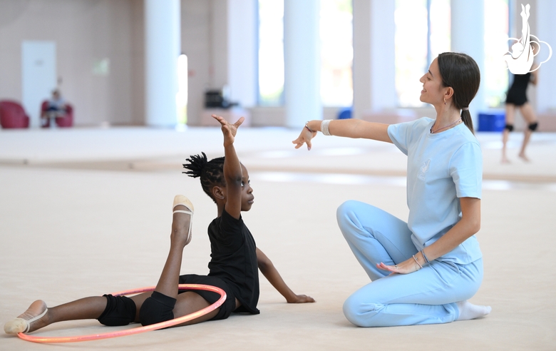 Academy coach Elizaveta Chernova with gymnast Nkenko Sita Davina Chanselvi during the training session