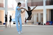 Academy coach Elizaveta Chernova with gymnast Nkenko Sita Davina Chanselvi during the training session