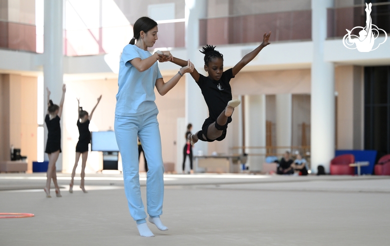 Academy coach Elizaveta Chernova with gymnast Nkenko Sita Davina Chanselvi during the training session