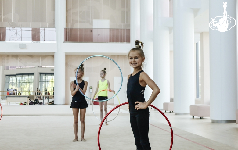 Young rhythmic gymnast from Gatchina poses during a class