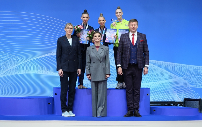 March 15, 2026. Olympic champion Alina Kabaeva, TV presenter Dmitry Guberniev, and two-time Olympic bronze medalist in basketball Natalia Vodopyanova with the medalists of the Alina Kabaeva Grand Prix Champions Cup all-around