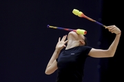 Gymnast during an exercise with clubs at floor testing